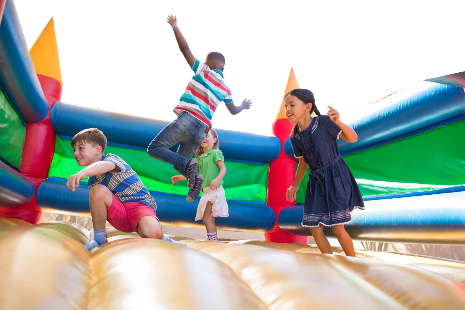 Kids jumping in an inflatable bounce house