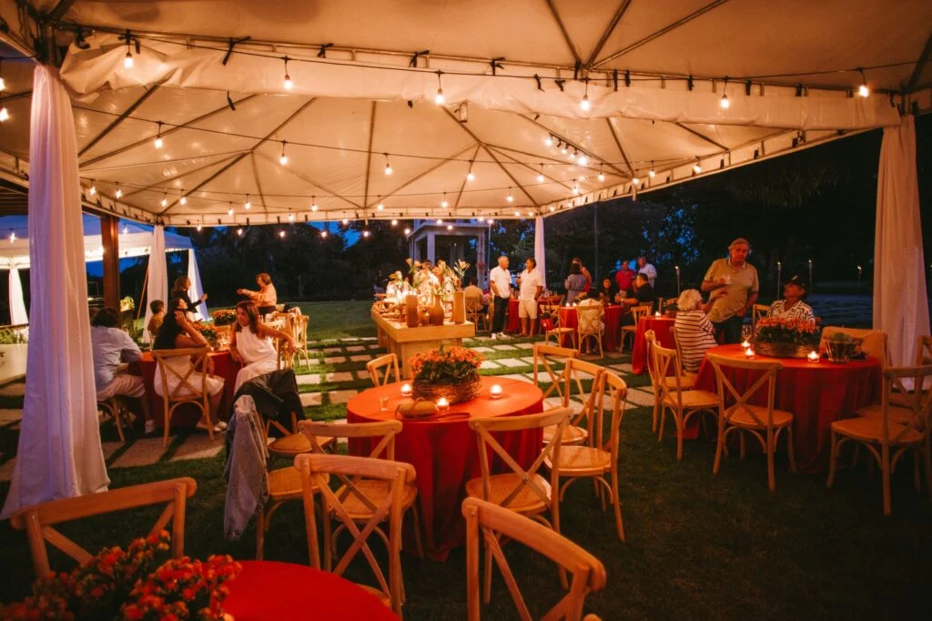 Evening reception under a frame tent with string lights