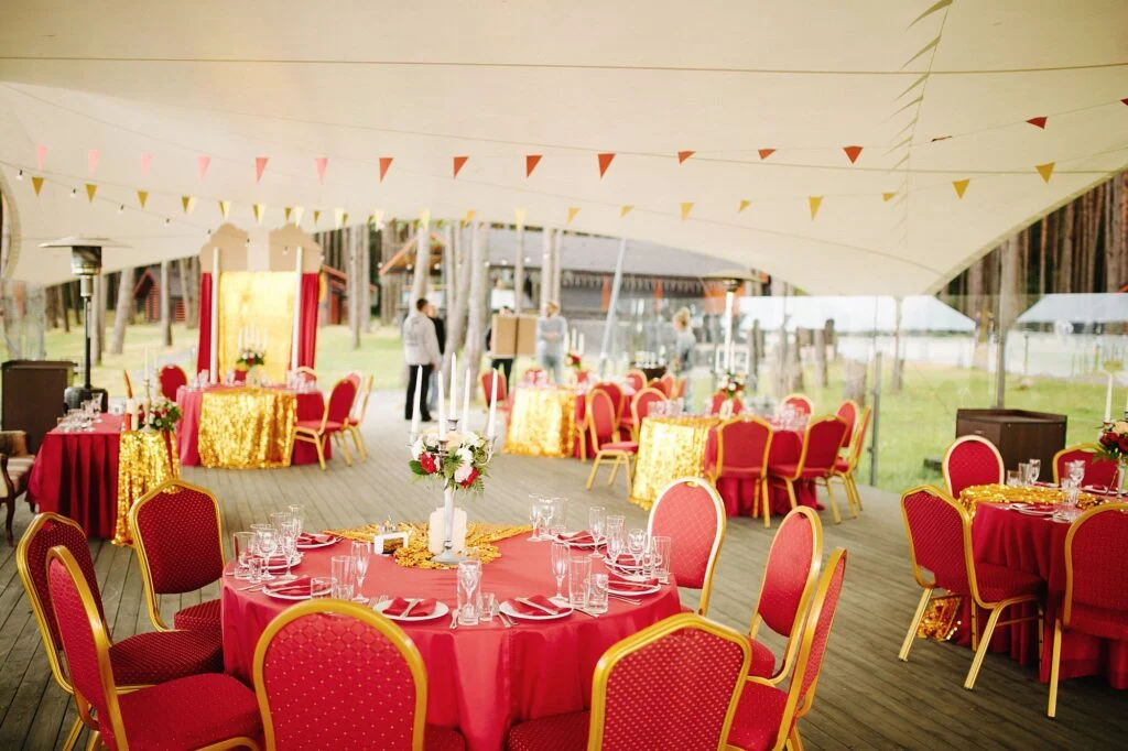 Reception dinner set under a large tent