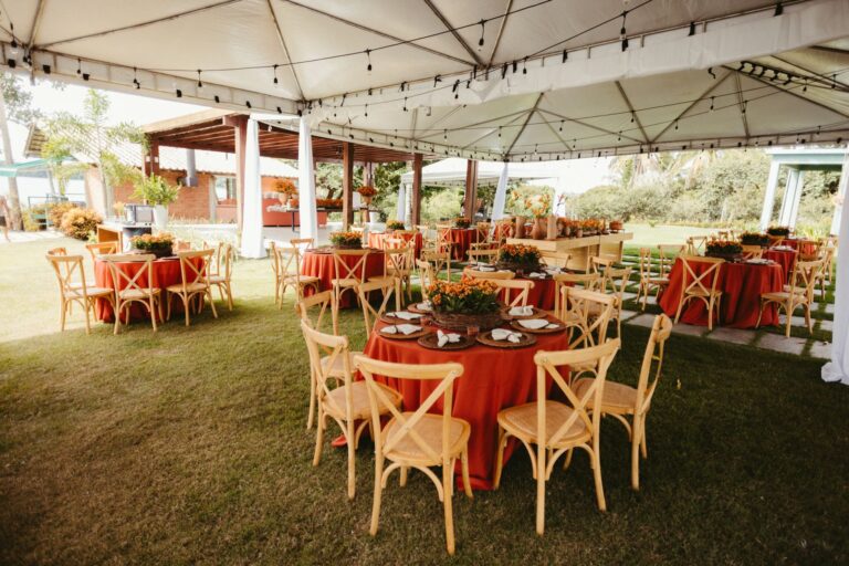 Wedding reception tables under a white tent